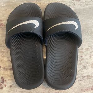 Nike Black Slides with White Swoosh.  EUC.  Size 11 kids.